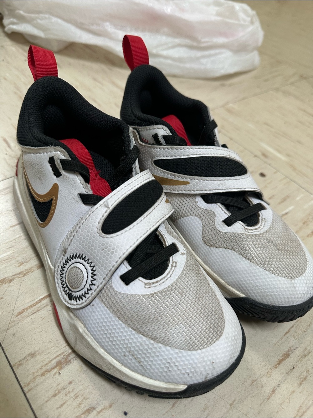 Nike Kids White Black Sneakers with Gold and Red Accents